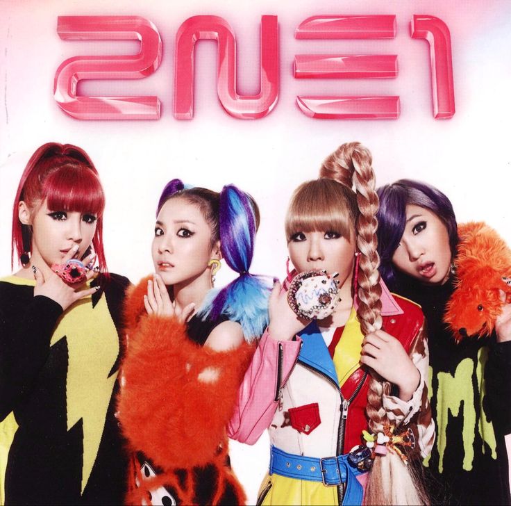 the girls are posing in front of a neon sign with their hair pulled back and wearing colorful outfits