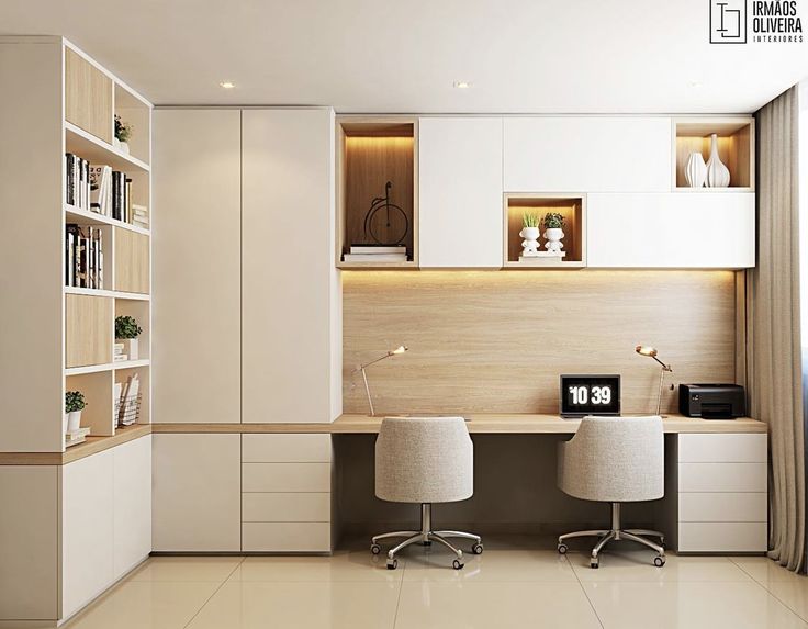 two white chairs sitting in front of a desk