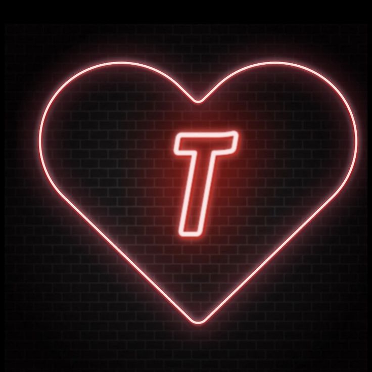 a heart shaped neon sign with the letter t in it