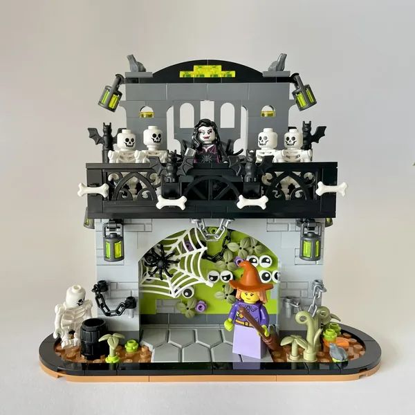 a lego halloween scene with skeletons and witches