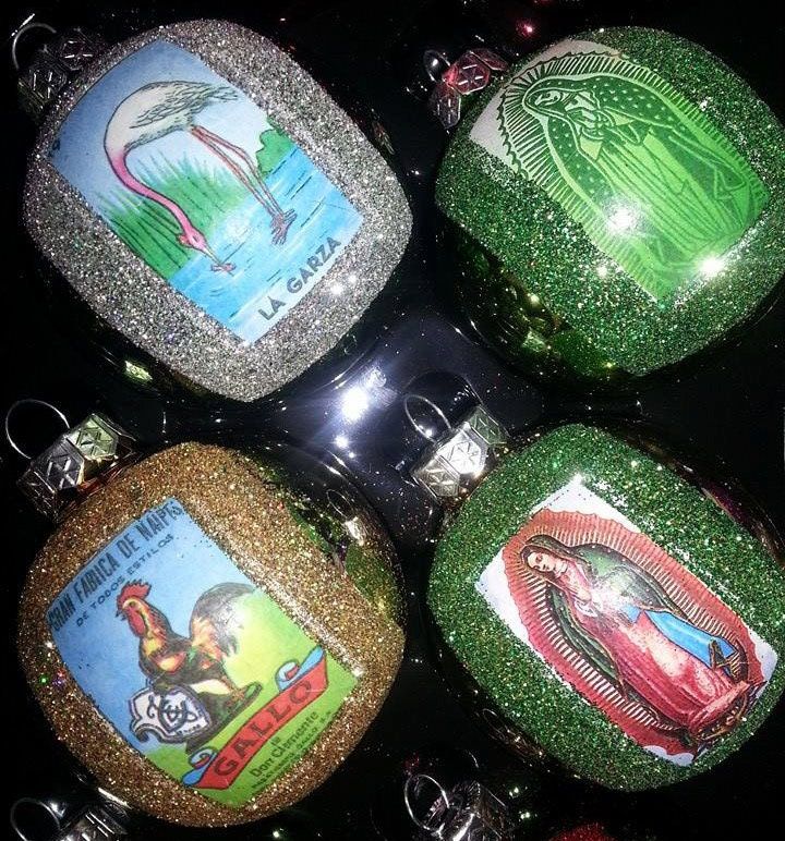 four christmas ornaments with green glitter and pictures on them