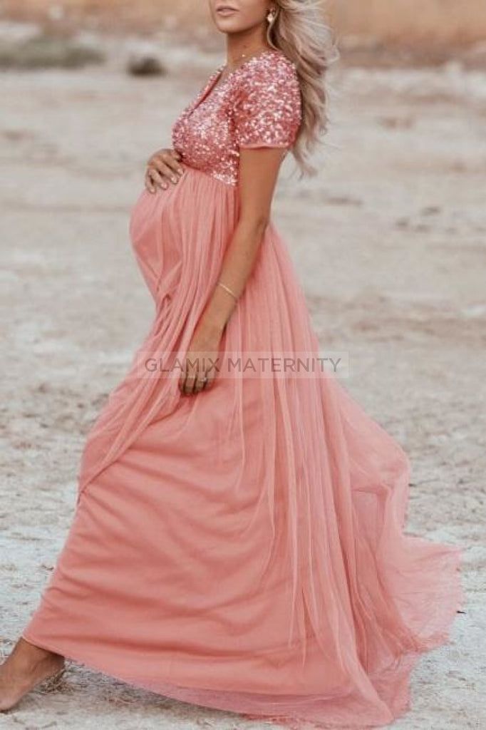 Pink Sequined Short Sleeves Sparkly Maternity Maxi Dress – Glamix Maternity Fitted V-neck Maternity Dress For Beach, Pink V-neck Maternity Maxi Dress, Flowy Maternity Maxi Dress For Beach, Flowy Maxi Length Maternity Dress For The Beach, Flowy Maxi Maternity Dress For The Beach, Flowy Maxi-length Maternity Dress For Beach, Flowy Summer Maternity Dress, Summer Flowy Maternity Dress, Spring Beach Maternity Dress With Short Sleeves