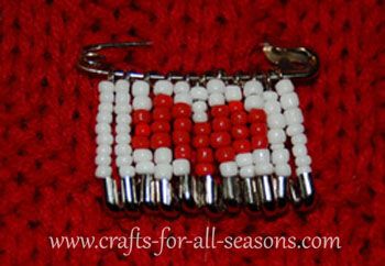 a red and white beaded purse on a red background