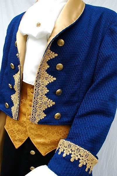 a mannequin wearing a blue jacket with gold trimmings and a white shirt