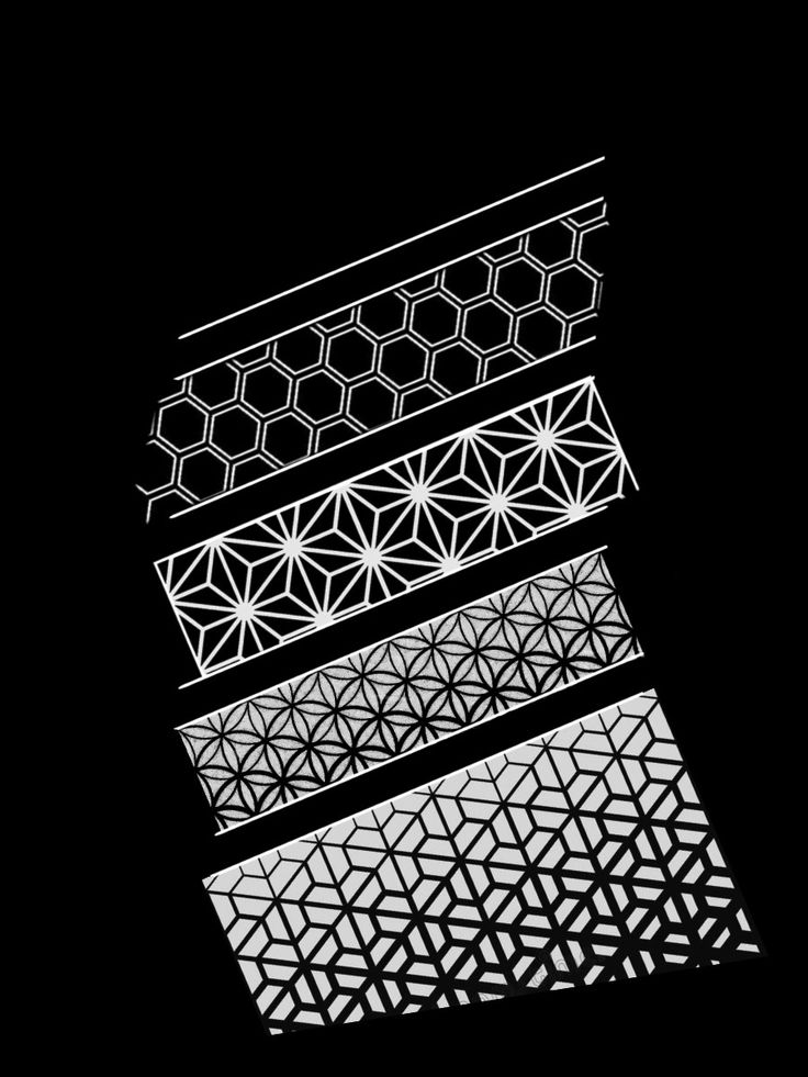 an abstract black and white photo with geometric designs on it's sides, in the dark