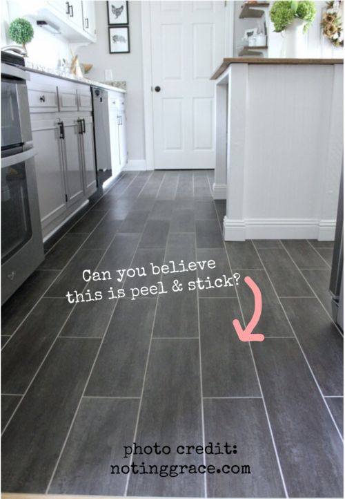 a kitchen floor with the words can you believe this is peel and stick?