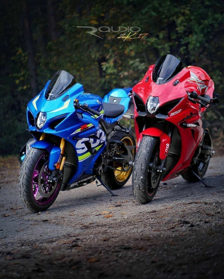 two motorcycles parked side by side on the road