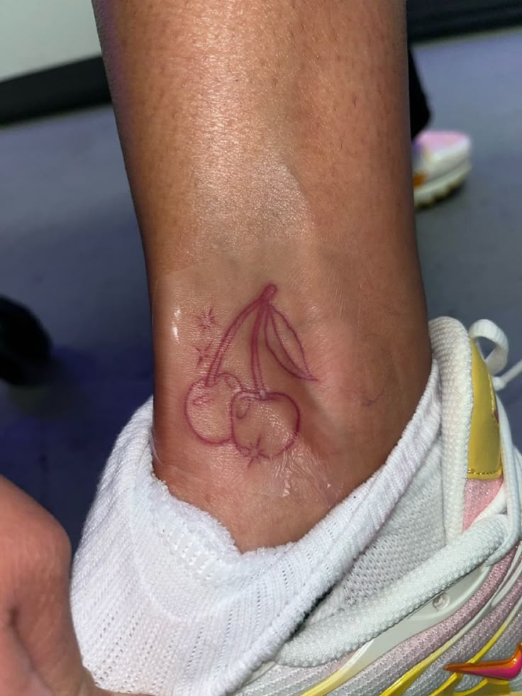 a person with a small tattoo on their foot