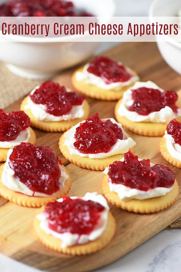 cranberry cream cheese appetizers on a wooden board