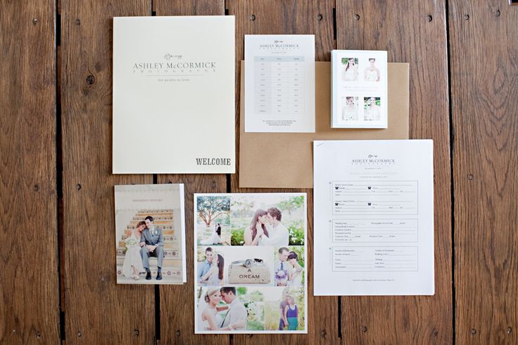 the wedding stationery is laid out on top of the wooden table with photos and papers