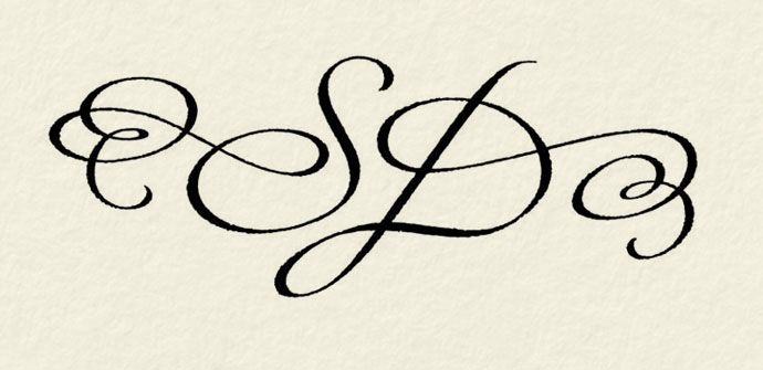 the letters s and p are in cursive handwriting