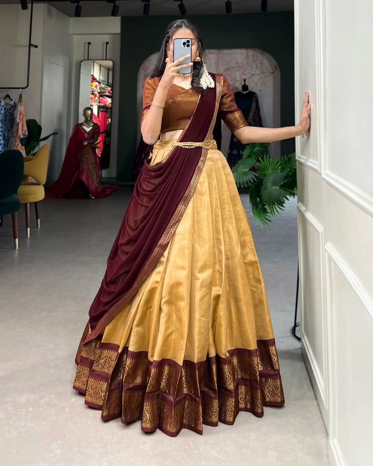 Rate : 1150 #apex__outfit Crafted with love, adorned with heritage : The South-style Kanchipuram silk lehenga is more than just attire; it's a piece of art that encapsulates the essence of South Indian culture 🪸 Lehenga(Stitched) : Lehenga Fabric : Kanchipuram Lehenga Work : Zari Weaving Work Lehenga Waist : SUPPORTED UP TO 42 Lehenga Closer : Drawstring With Zip Stitching : Stitch With Canvas Length : 41 Flair : 3.70 Meter Inner : Micro Cotton Blouse(Unstitched) : Blouse fabric : Kanchip... Kanchipuram Lehenga, South Indian Culture, Zip Stitching, Onam Outfits, Simple Lehenga, Cotton Lehenga, Half Saree Lehenga, Long Gown Design, Stitched Lehenga