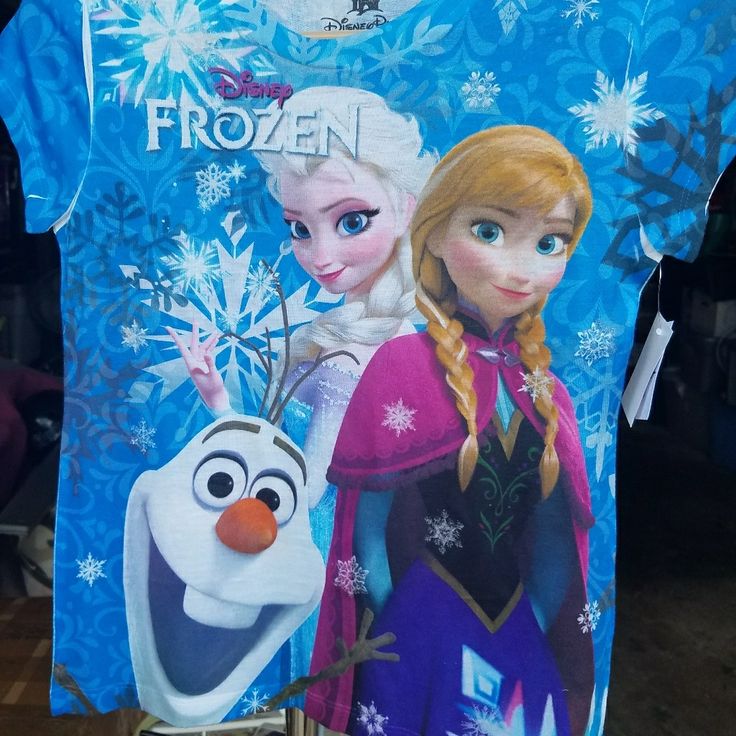 Disney Frozen Girls Medium Shirt New With Tags Fun Blue Tops For Winter, Blue Cartoon Print Tops For Disney Fan Events, Fun Short Sleeve Winter Tops, Cute Blue Shirt With Character Print, Blue Short Sleeve Themed Tops, Blue Themed Shirt With Character Print, Blue Short Sleeve Themed Shirt, Disney Graphic Print Blue Shirt, Frozen Shirt