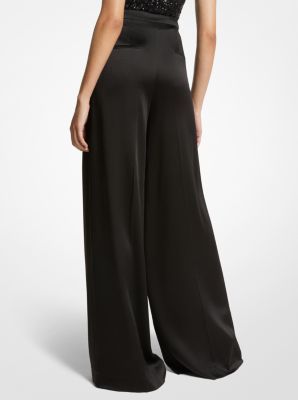 A masterclass in everyday sophistication, these palazzo pants are finely tailored in Italy from liquid-like satin and dyed in a versatile noir hue. The mid-rise silhouette features finely pressed creases that lend effortless movement with each step. Further accentuate the dramatic wide-leg cut with soaring high-heel sandals. Satin Palazzo Pants, Pants Satin, Palazzo Pant, Palazzo Pants, Heel Sandals, High Heel Sandals, Master Class, High Heel, Sandals Heels