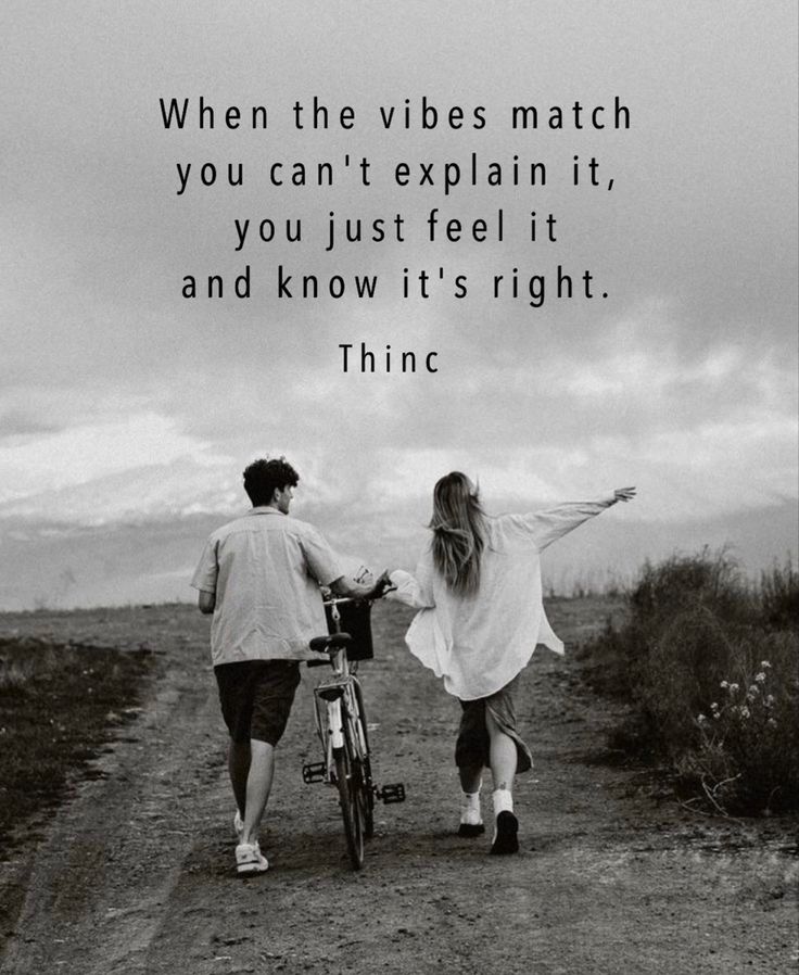 two people walking down a dirt road with a bike and the words, when the vibes match you can't explain it, you just feel it, and know it's right