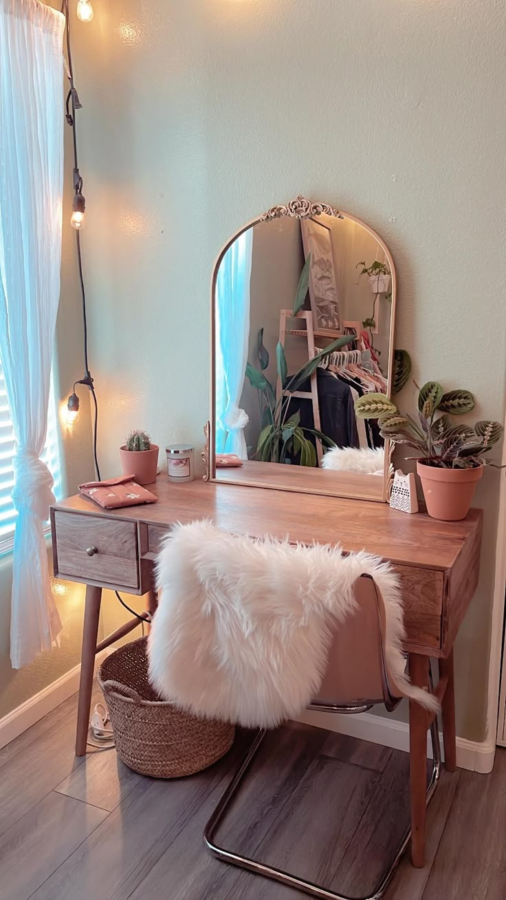 a desk with a mirror, potted plants and a bench in front of it