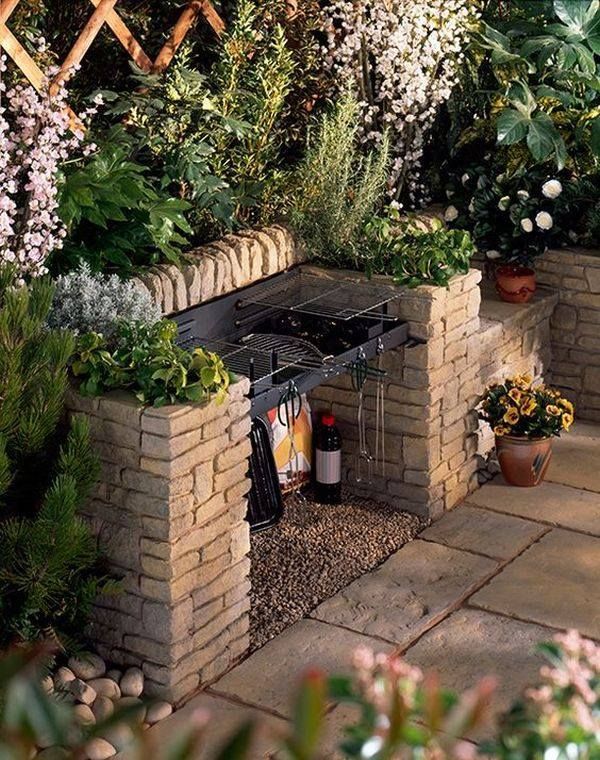 an outdoor kitchen made out of bricks and plants