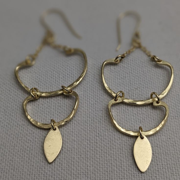 The stunning Amu Earrings! These elegant and lightweight dangle earrings feature a chic hook design made from high-quality brass metal and finished with a beautiful platino goldtone. You'll feel confident and stylish wearing these versatile earrings for any occasion. Don't sacrifice comfort for fashion - make a statement with the Amu Earrings today! Dangle style hook earrings Brass metal Platino goldtone Chic and elegant Lightweight Weight 6 grams Length 3.07 inches Chic Gold-tone Metal Earrings, Metal Chandelier Earrings With French Hook, Elegant Metal Chandelier Earrings With Lever Back, Nickel Free Brass Dangle Teardrop Earrings, Nickel Free Brass Teardrop Dangle Earrings, Nickel-free Brass Dangle Teardrop Earrings, Gold-tone Metal Teardrop Earrings, Adjustable Metal Plug Earrings, Elegant Style, Gold-tone Teardrop Pierced Earrings