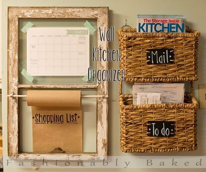 a kitchen wall with baskets and magnets on it