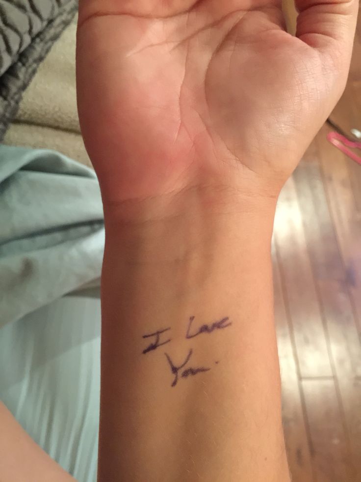 a person's arm with a tattoo on it that says, i love you