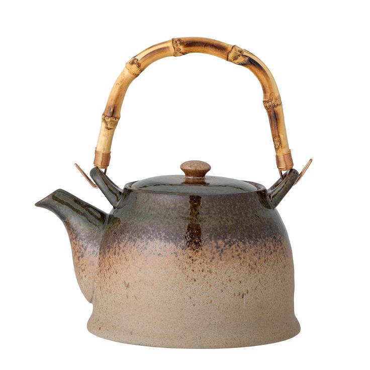 a teapot with bamboo handles and handle is shown on a white background in this image