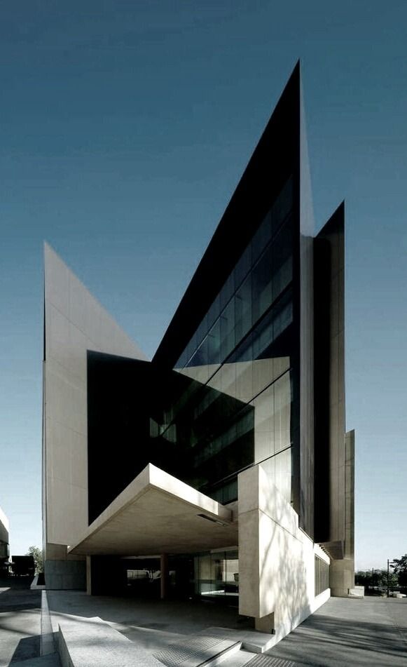 the building is very large and has an unusual design on it's side,