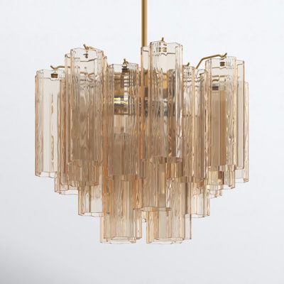 a chandelier made out of clear glass tubes and brass fittings on a white background