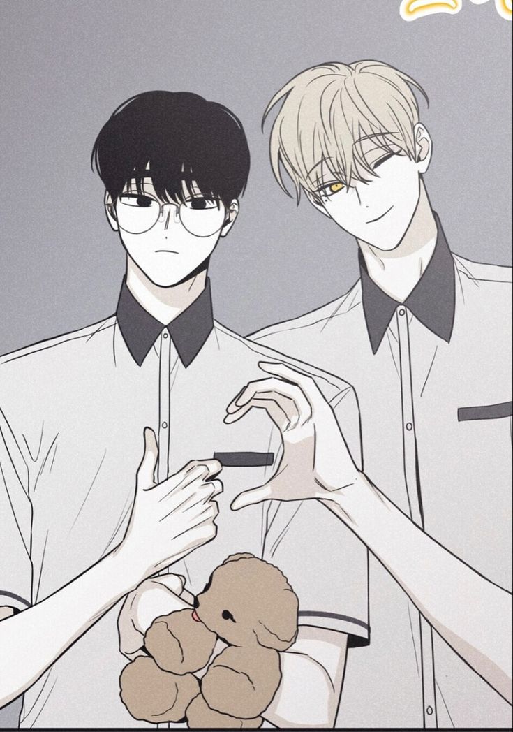 two people are holding a teddy bear in front of their face and one is wearing glasses