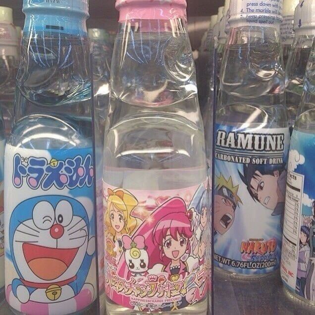 several bottled water bottles with cartoon characters on them