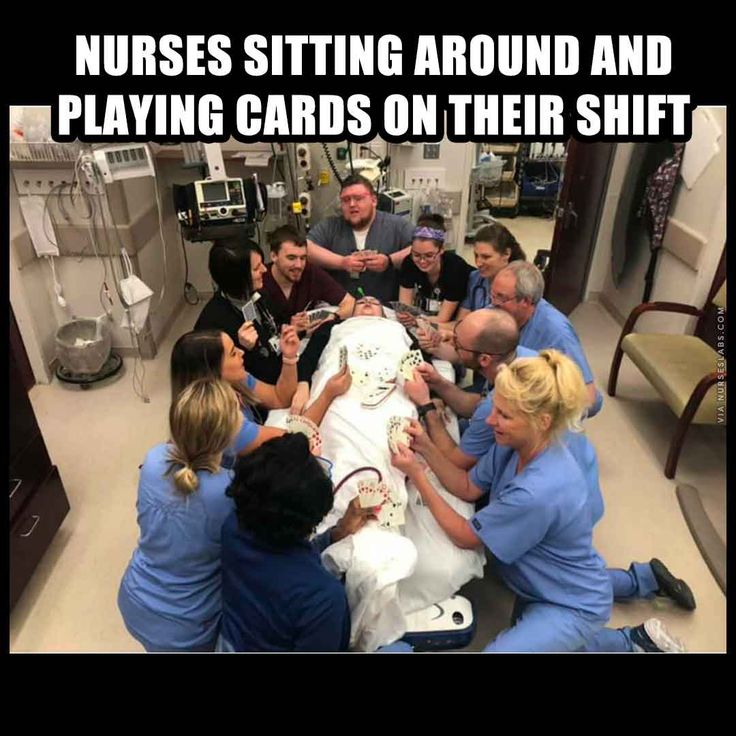 nurses sitting around and playing cards on their shift to help them get ready for surgery