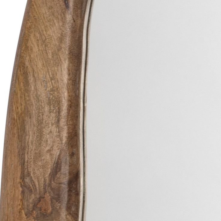 a close up of a wooden object on a white surface with wood grained edges