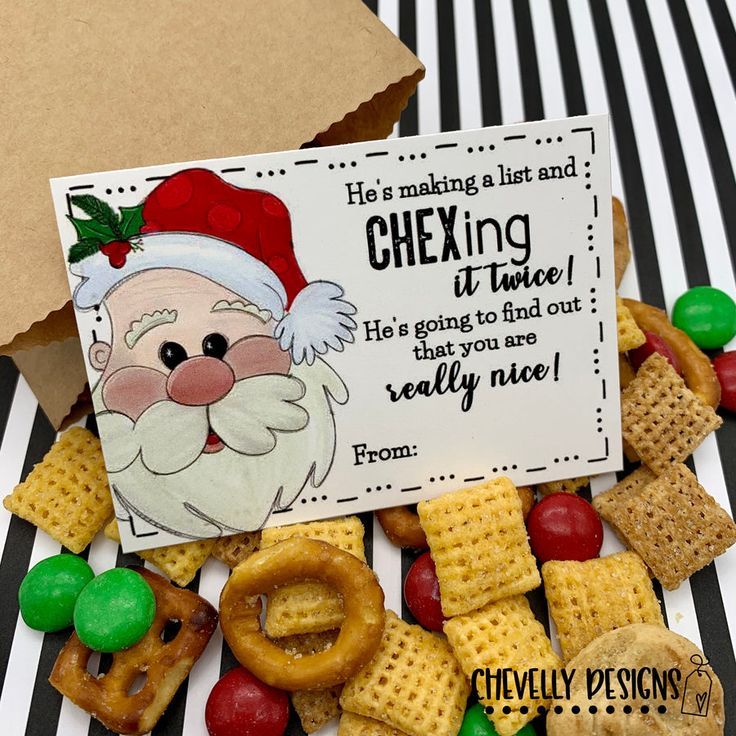 a christmas card surrounded by pretzels and crackers