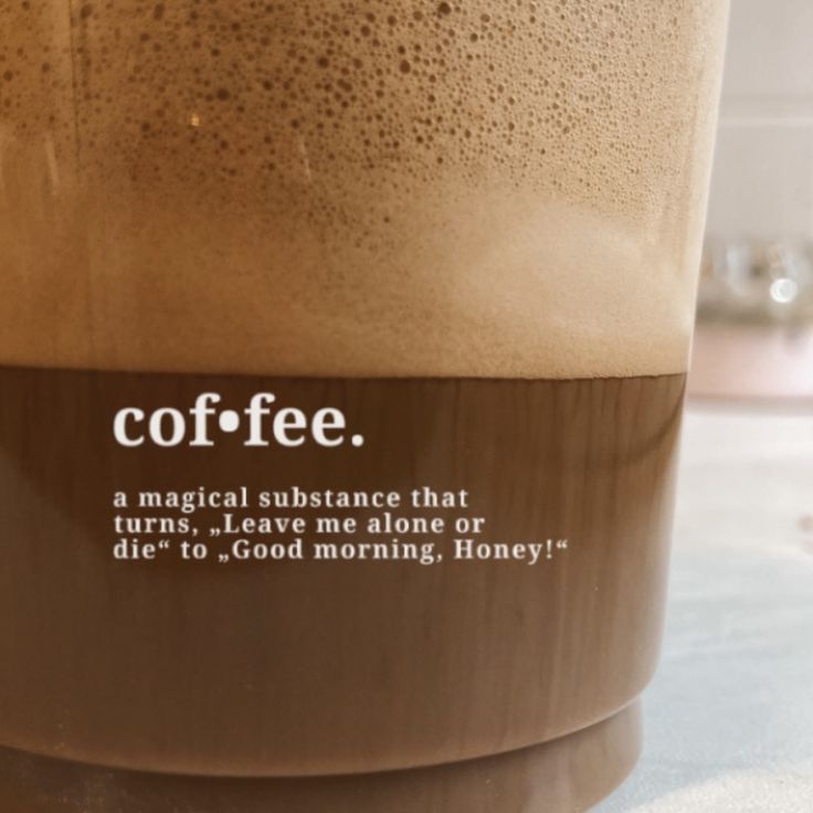 there is a cup that has coffee in it