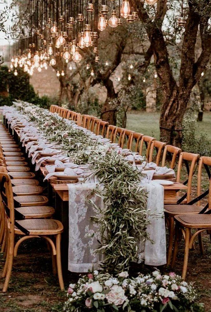 a long table set up for an outdoor dinner