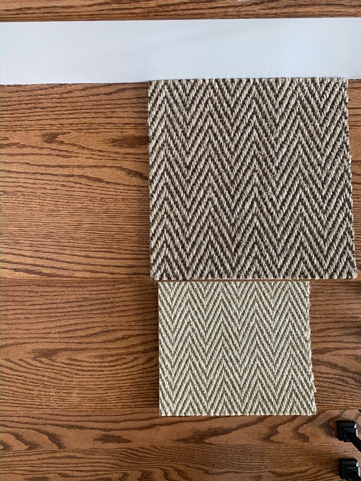 some brown and white fabric on top of a wooden table next to a pair of scissors