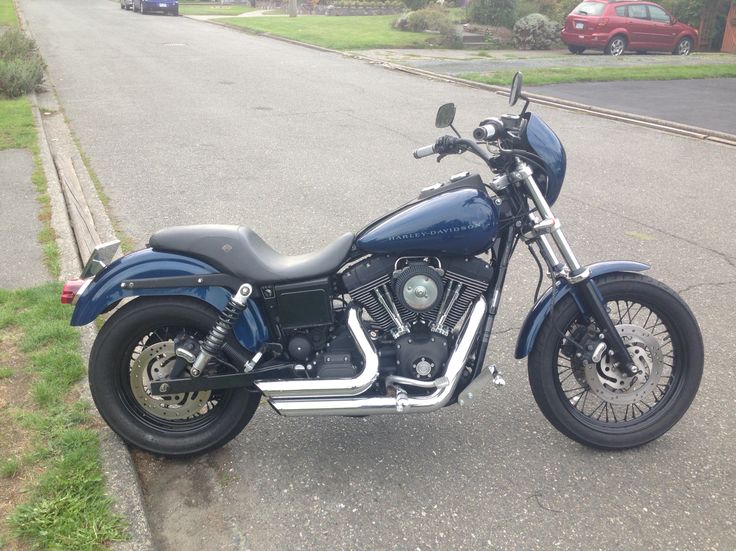 a motorcycle is parked on the side of the road