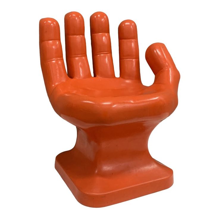 an orange plastic hand that is in the shape of a chair