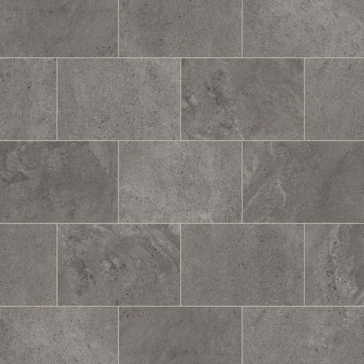 a tile floor with grey tiles on it