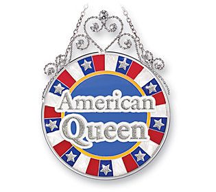 an american queen sign hanging from a chain