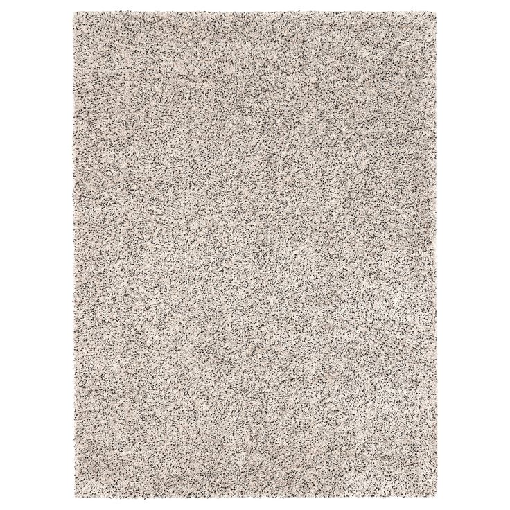 a gray rug with small white dots on it