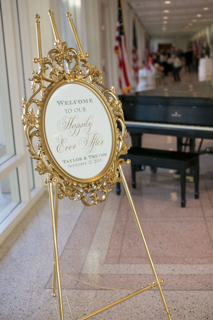 a welcome sign in front of a piano