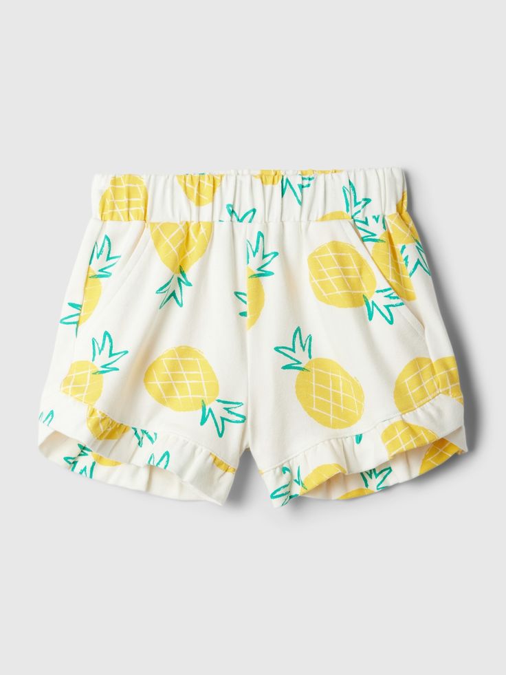 Soft, stretch cotton pull-on shorts.  Elasticized waist.  Front slant pockets.  Ruffle at hem.  Certain styles have allover prints.  Easy pull-on waist.  Hits above the knee.  Sizes range from baby to toddler. Yellow Pineapple, Pineapple Yellow, Ruffle Shorts, Tummy Time, Baby Gap, The Gap, Mix N Match, Above The Knee, Mix And Match