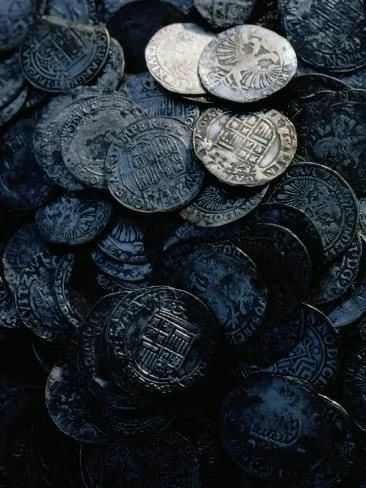 a pile of coins sitting next to each other