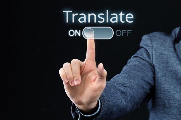 a man in a business suit pressing on the transparent button that reads translation on off