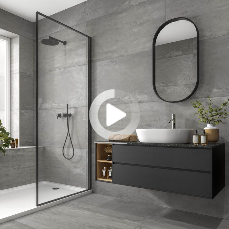 a bathroom with a sink, mirror and bathtub in grey color scheme on the wall