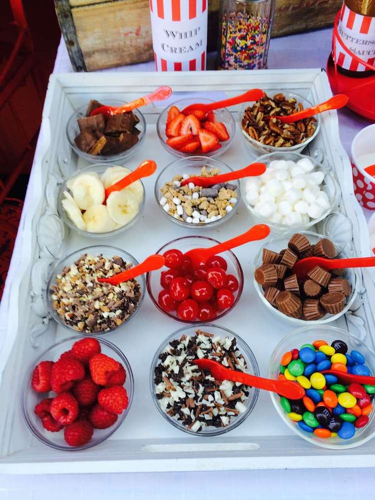 a tray filled with lots of different types of food on top of a white table