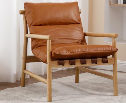 a brown leather chair sitting on top of a rug in front of a white wall