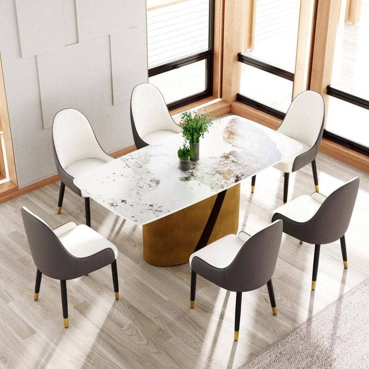 a dining table with four chairs around it