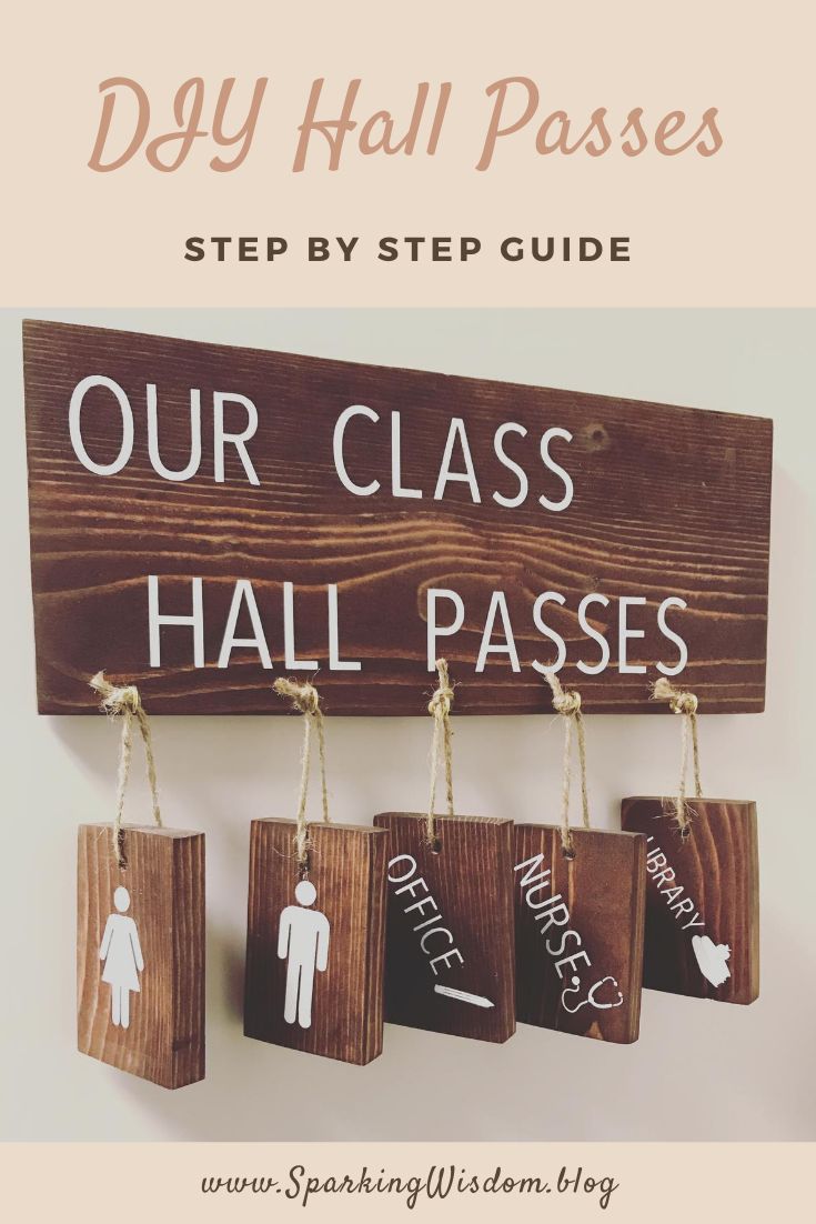 a wooden sign that says our class hall passes