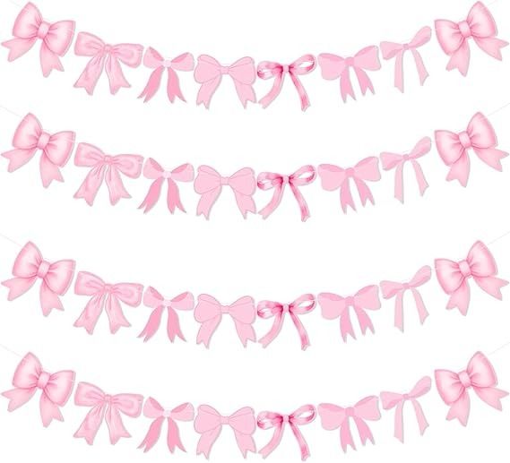 pink ribbon with bows on white background